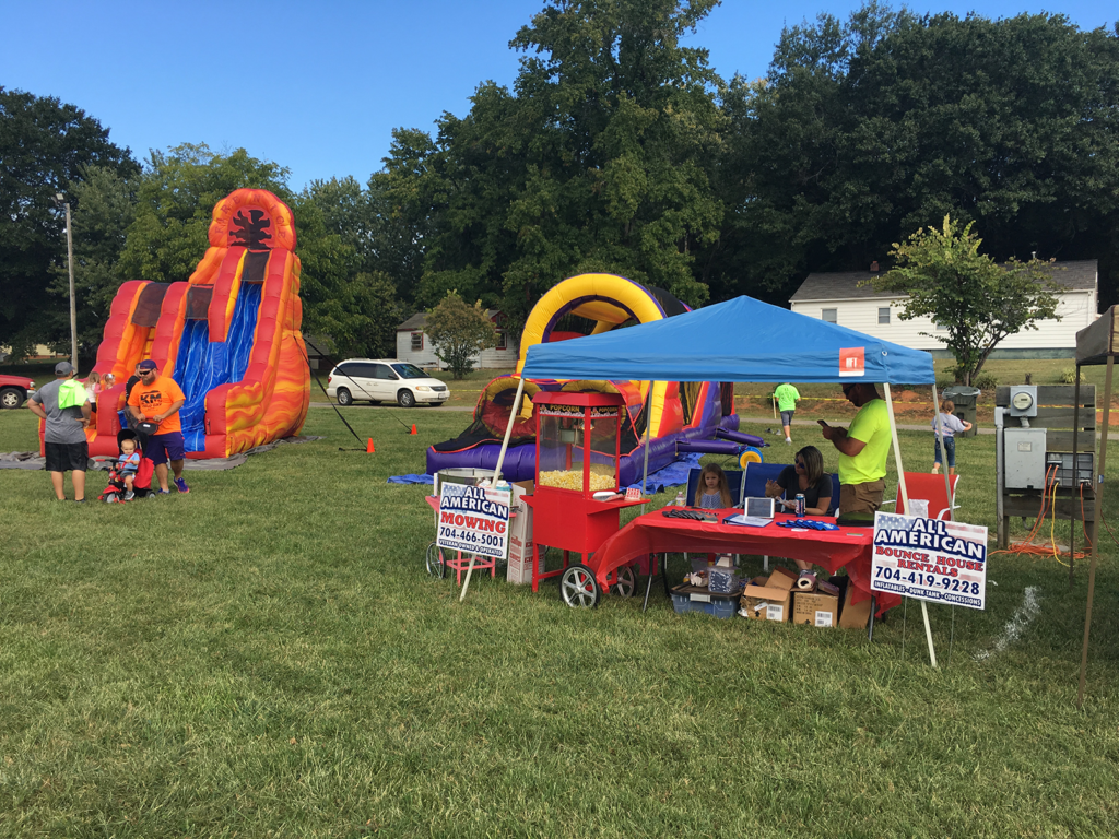 All American Bounce House party inflatables, tent, and popcorn machine
